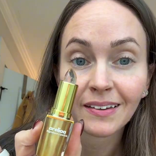 Brittany B. holding the Areliaa Signature Lipstick