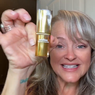 Michelle G. holding the Areliaa Signature Lipstick