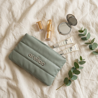 Areliaa Puffer Pouch flat lay with Areliaa lipstick, plumper and gloss