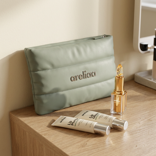 Areliaa Puffer Pouch on a vanity with Areliaa lipstick, plumper and gloss