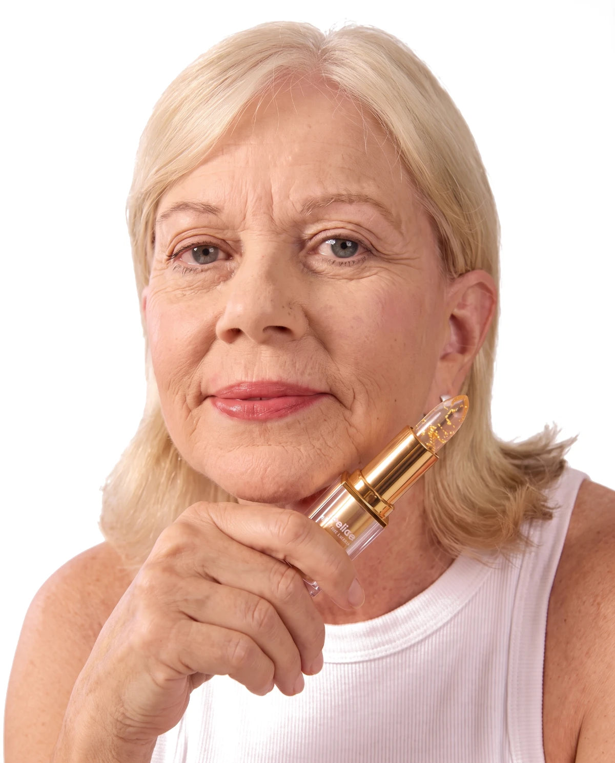 Woman holding the Areliaa Signature Lipstick